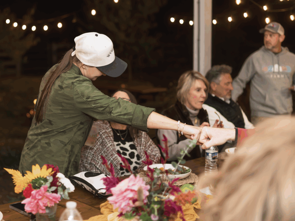 Chef Lynsey fist bumping guest